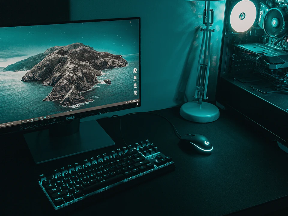 Desktop computer with a tower PC, monitor, keyboard, and mouse on a desk